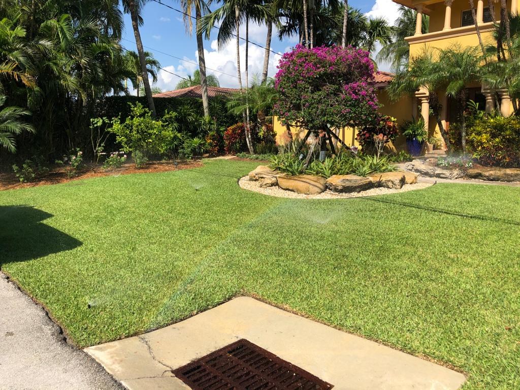 Irrigation system watering a landscaped property